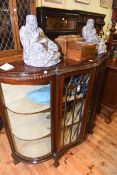 Early 20th Century mahogany shaped front two door china cabinet on ball and claw legs