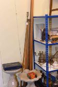 Collection of vintage billiard cues and rests,