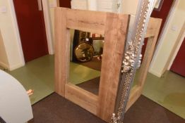 Large rustic mirror with wooden board surround,