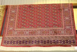 Red ground Bokhara carpet 2.30 by 1.