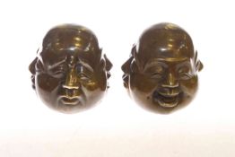 Pair of bronze buddha heads