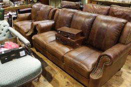 Brass studded and tan leather three-seater settee and two-seater settee en suite (2)