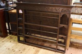 Oak plate rack, with scroll carved frieze, 148.