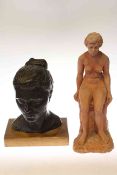 Plaster bust of girl and terracotta nude