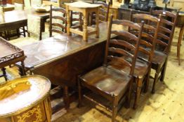 Large hardwood gateleg table and six chairs