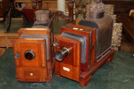 Two Thornton-Packard mahogany enlargers