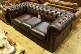 Ox blood deep buttoned leather three-seater Chesterfield settee,