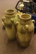 Pair of tall four handled stone finish garden vases