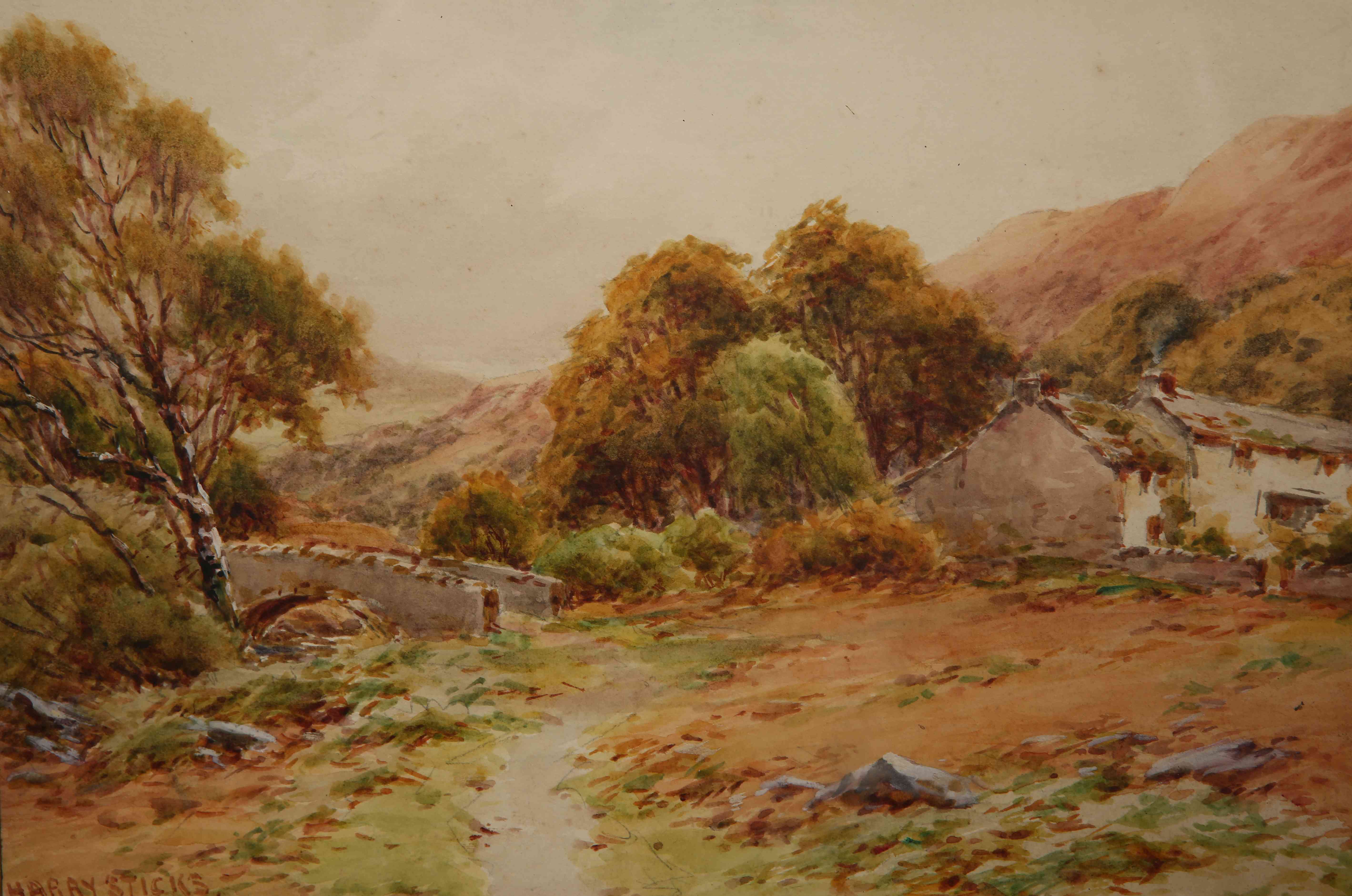 HARRY STICKS (1867-1938), COTTAGES BY AN OLD STONE BRIDGE, signed lower left, watercolour, framed.