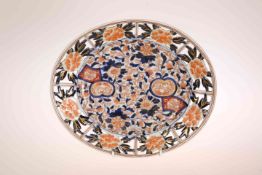 A JAPANESE IMARI OVAL PLATE, LATE 19TH/EARLY 20TH CENTURY, typically decorated with cobalt blue,