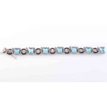 AN ART DECO DIAMOND, BLACK ONYX AND BLUE ZIRCON BRACELET,