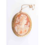 A SHELL CAMEO BROOCH, circa 1900, the oval cameo carved to depict the profile of a maiden,