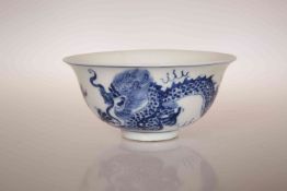A SMALL CHINESE BOWL, the exterior painted with a five-clawed dragon chasing a flaming pearl,