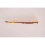 A 9 CARAT GOLD PROPELLING PENCIL, engraved with a monogram. 18.4 grams, 9.