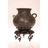 A CHINESE BRONZE POT OF BALUSTER FORM,