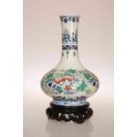 A CHINESE PORCELAIN VASE, of baluster form with elongated neck,