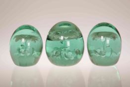 A GROUP OF THREE GREEN GLASS "DUMP" PAPERWEIGHTS, THIRD QUARTER 19th CENTURY,