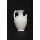 A CHINESE WHITE-GLAZED EWER, SONG DYNASTY, of baluster form, with flared neck,
