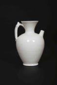 A CHINESE WHITE-GLAZED EWER, SONG DYNASTY, of baluster form, with flared neck,