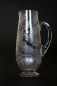 A 19th CENTURY ENGRAVED GLASS WATER JUG, of slender ovoid form,