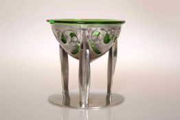 ARCHIBALD KNOX (1864-1933) FOR LIBERTY & CO A TUDRIC PEWTER COUPE, no. 0276, with green glass liner.