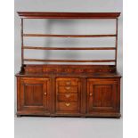 A GOOD GEORGE III OAK DRESSER AND RACK, the open rack with three shelves and moulded cornice,
