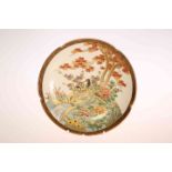 A FINE JAPANESE SATSUMA PLATE, painted with two birds on a riverbank, highlighted with gilding,