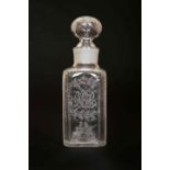 AN EARLY 19th CENTURY ENGRAVED GLASS DECANTER, of square form,