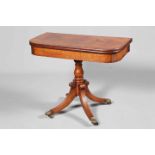 A REGENCY MAHOGANY FOLDOVER TEA TABLE, the crossbanded top with rounded corners,