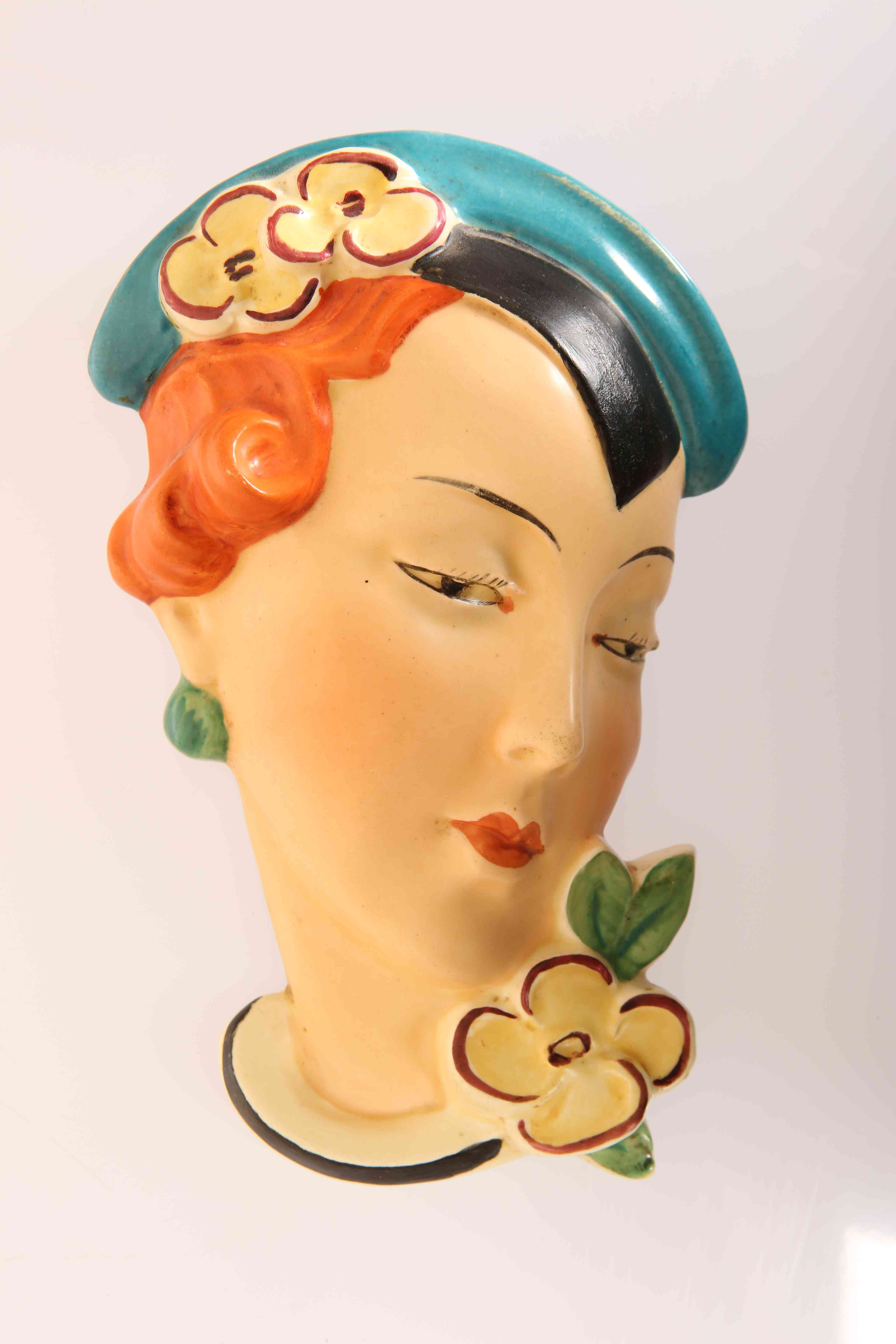 A ROYAL DUX CZECHOSLOVAKIA POTTERY WALL MASK, c.