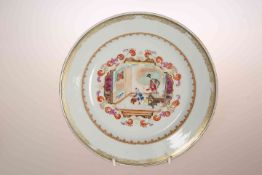 A CHINESE EXPORT PLATE, enamel painted with two figures and a dog in an interior,
