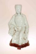 A LARGE CHINESE CELADON GLAZED POTTERY FIGURE OF QUAN YIN,