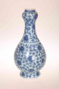 A CHINESE BLUE AND WHITE PORCELAIN VASE, of baluster form, with "garlic" neck,