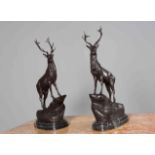 AFTER MOIGNIEX, A LARGE PAIR OF BRONZE STAGS, on stepped marble bases.