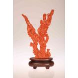 A CHINESE CARVED RED CORAL FIGURE GROUP,