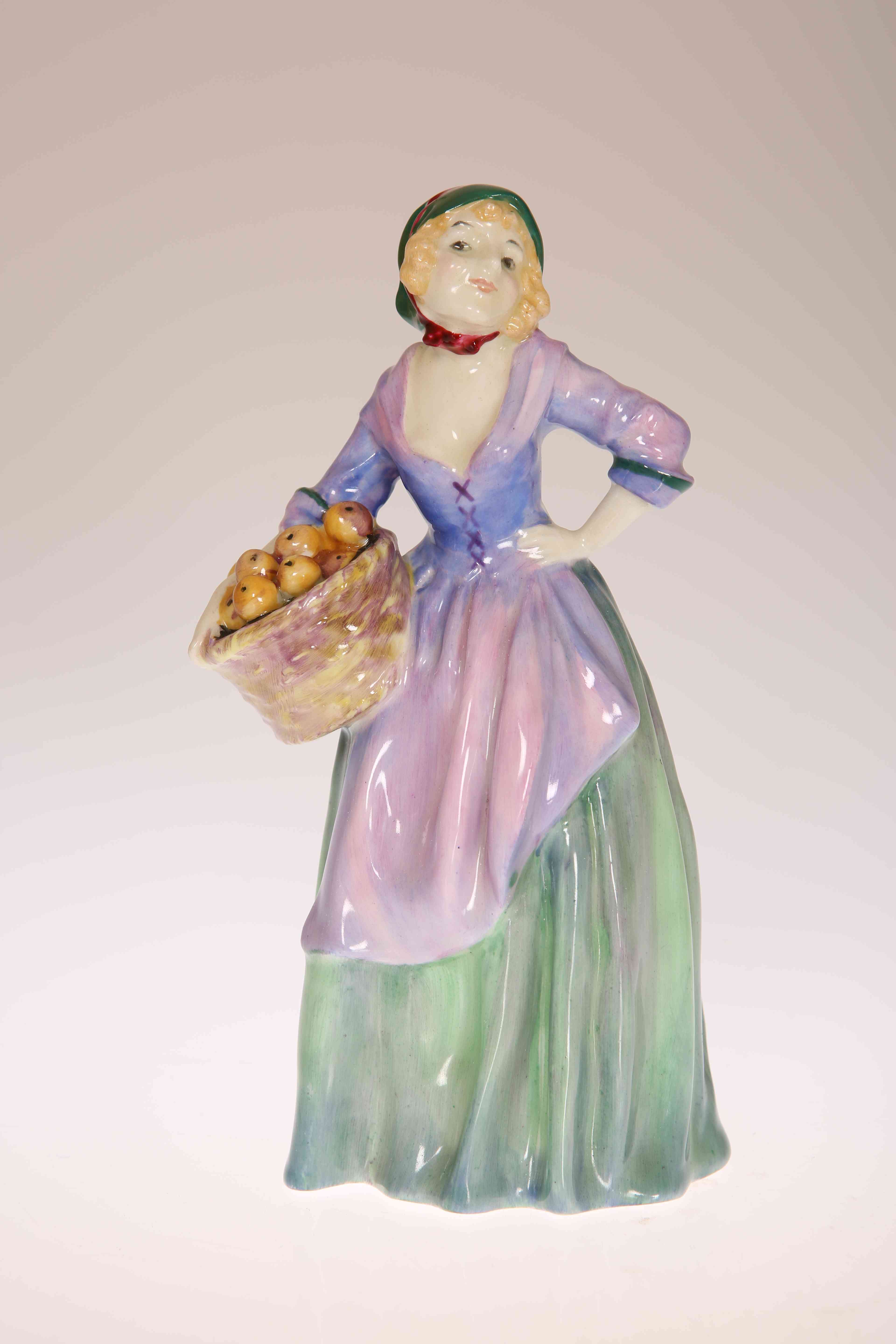 A ROYAL DOULTON FIGURE, THE ORANGE SELLER, HN1325, painted and printed marks.