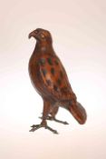 AN UNUSUAL LEATHER MODEL OF A HAWK, modelled standing upright.