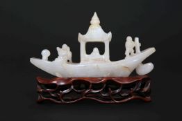 A CHINESE CARVED JADE MODEL OF A RIVER BOAT, the stone grey/white,