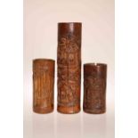 THREE CHINESE BAMBOO VASES, each of cylindrical form,