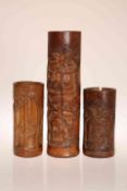 THREE CHINESE BAMBOO VASES, each of cylindrical form,
