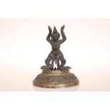 A SINO-TIBETAN BRONZE FIGURE, cast with arms aloft and bent at the knee,