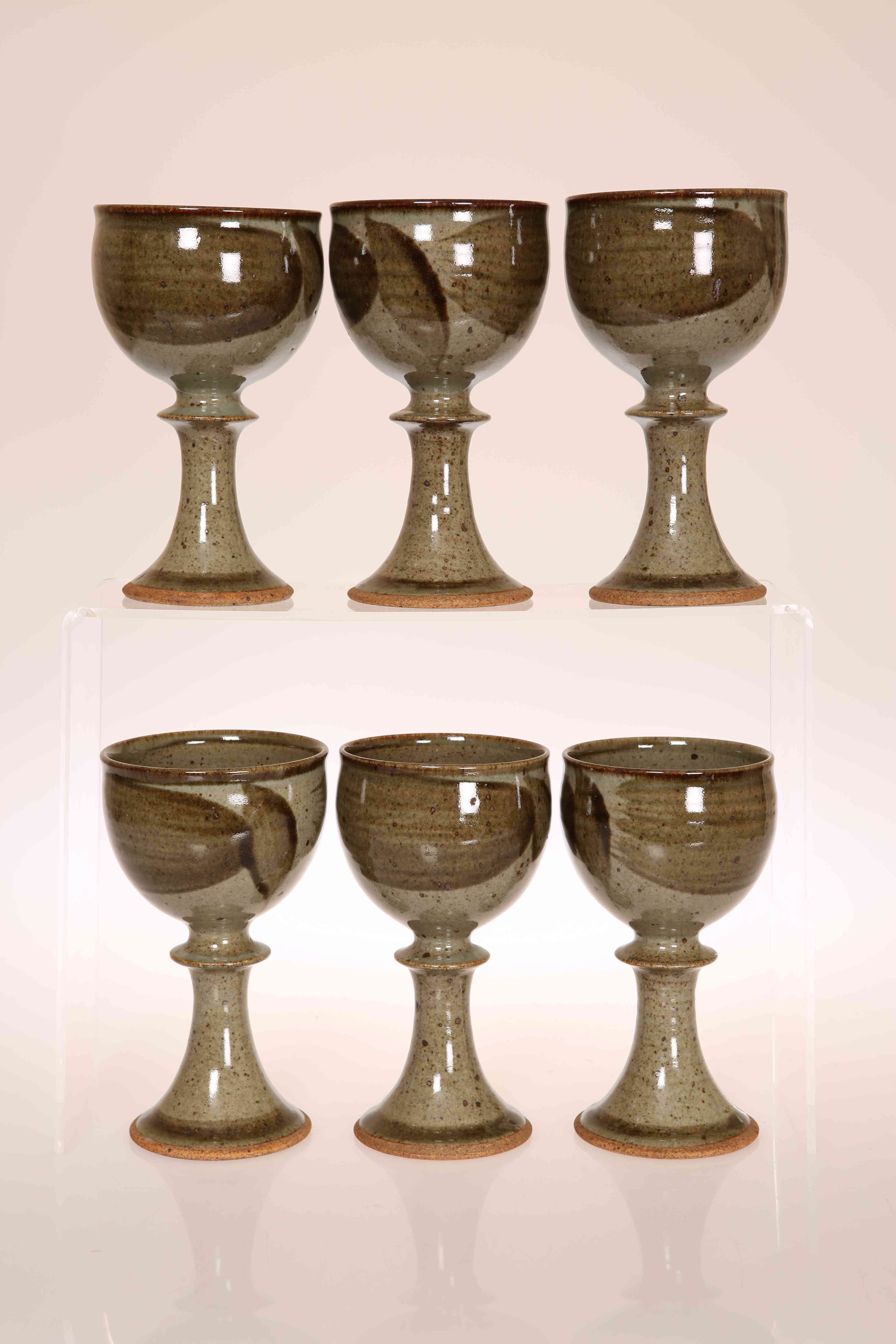 DAVID LLOYD JONES (1928-1994) A SET OF SIX STONEWARE GOBLETS, with Tenmoku glaze, seal marks.