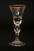 A LARGE 18TH CENTURY FOLDED FOOT WINE GLASS, with ball knop containing a tear drop,