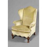 A WALNUT AND UPHOLSTERED WING CHAIR, EARLY 20TH CENTURY,