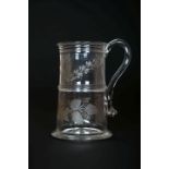 AN ENGRAVED GLASS TANKARD, LATE 18th CENTURY, of tapering cylindrical form,