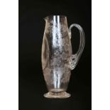 A 19TH CENTURY STOURBRIDGE ENGRAVED GLASS JUG, of slender ovoid form,