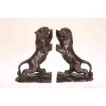 A PAIR OF JAPANESE BRONZE BOOKENDS MODELLED AS TIGERS, MEIJI PERIOD, circa 1900, each rearing,