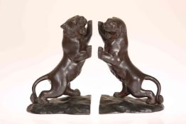 A PAIR OF JAPANESE BRONZE BOOKENDS MODELLED AS TIGERS, MEIJI PERIOD, circa 1900, each rearing,