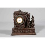 AN UNUSUAL CARVED OAK MANTEL CLOCK, 19TH CENTURY, boldly carved with foliage,