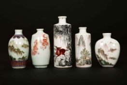 A GROUP OF FIVE CHINESE PORCELAIN SNUFF BOTTLES, of varying shapes, the largest cylindrical,